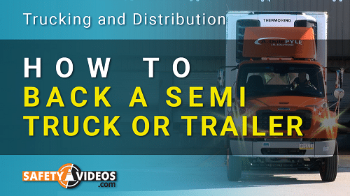 A semi-truck with a trailer is parked in front of a building. The image has the title 'How to Back a Semi Truck or Trailer' in large yellow letters and includes the website logo 'Safety Videos' at the bottom left corner. The background also features the text 'Trucking and Distribution' at the top.