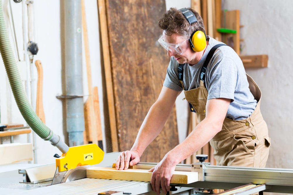 man using table saw