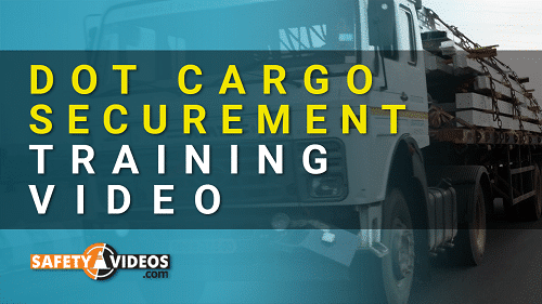 Cover image for a DOT Cargo Securement Training Video, featuring a semi-truck loaded with construction equipment. The text 'DOT CARGO SECUREMENT TRAINING VIDEO' is displayed prominently in bold white and yellow letters against a translucent black background, with the SafetyVideos.com logo at the bottom.