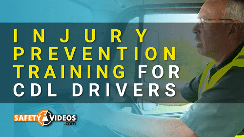 An informative graphic with bold text stating 'INJURY PREVENTION TRAINING FOR CDL DRIVERS' overlaid on an image of a CDL driver behind the wheel. The driver is wearing a high-visibility safety vest and glasses, and appears to be attentively operating a large vehicle. In the bottom right corner, the logo for SafetyVideos.com is visible, indicating that the image is likely promotional material for a safety training resource or course offered by the website.