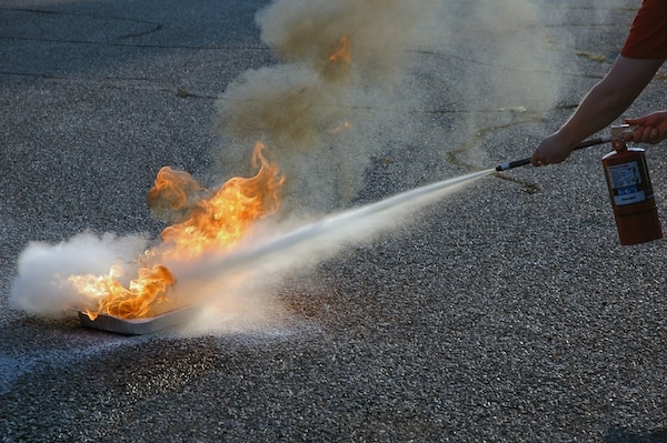 Using a Fire Extinguisher to Put out Flame