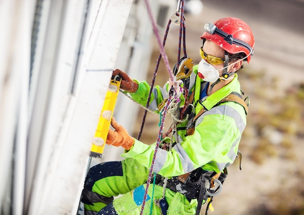 Worker With Full Fall Protection Gear