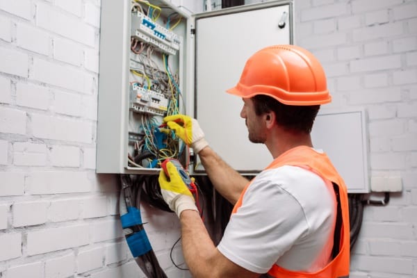 Electrician Working on a Panel