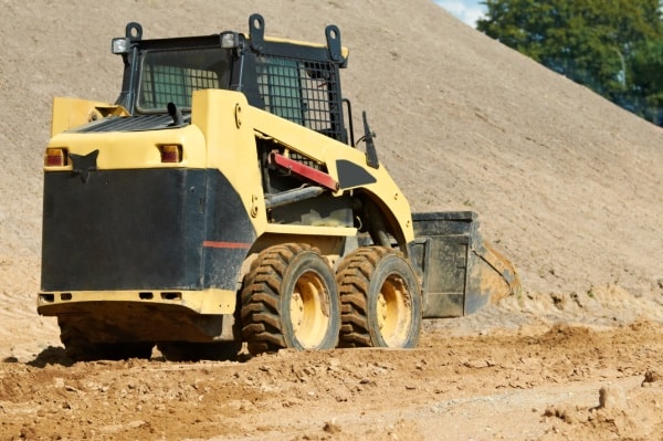 Skid Steer Loader Moving Dirt