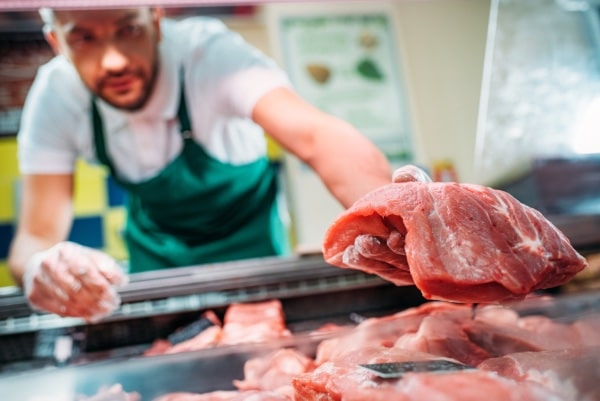 Butcher Cutting Meat