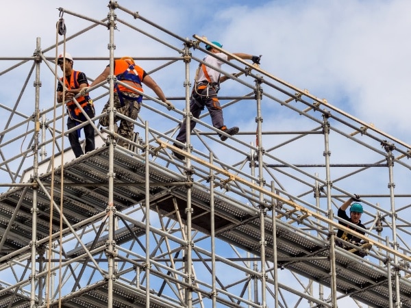 Group of Construction Workers on a Scaffold