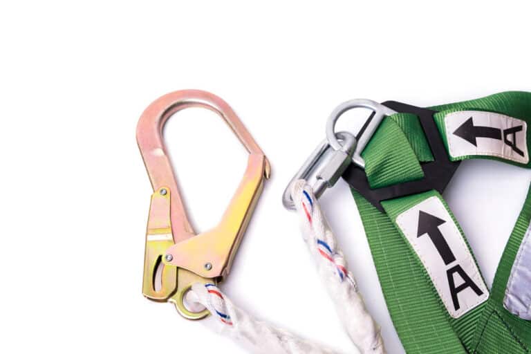 A green safety harness with a carabiner and a carabiner.