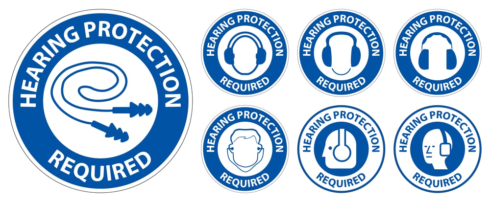 A set of blue and white stickers with the words hearing protection required.