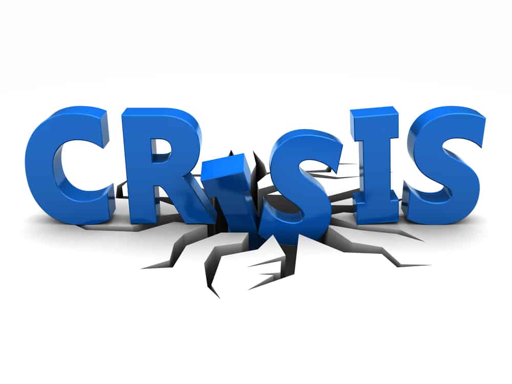 The word crisis is broken out of a white background.