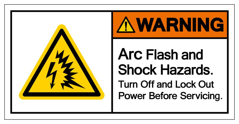 A yellow and black arc flash warning sign.